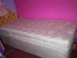 Two single beds with mattresses